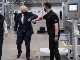 Britain's Prime Minister Boris Johnson tours the facility with managing director Jeff Pratt (left) as he meets a member of staff during a visit to the UK Battery Industrialisation Centre in Coventry. Picture: AFP via Getty Images






West Midlands.
15th July 2021 (Photo by David Rose / POOL / AFP) (Photo by DAVID ROSE/POOL/AFP via Getty Images)