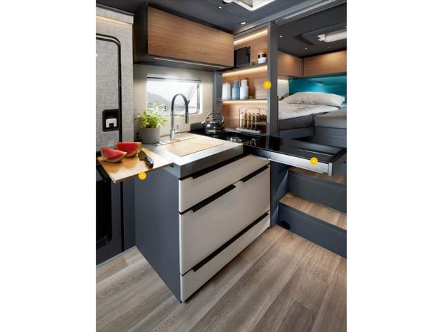 The optional kitchen package includes a pull-out cutting board, a kitchen shelf that electrically folds away when not in use and an extendable working surface.
