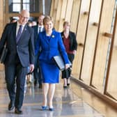 Outgoing First Minister Nicola Sturgeon and outgoing Deputy First Minister John Swinney (left) arrive for her last First Minster's Questions. Picture: Jane Barlow/PA Wire