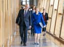 Outgoing First Minister Nicola Sturgeon and outgoing Deputy First Minister John Swinney (left) arrive for her last First Minster's Questions. Picture: Jane Barlow/PA Wire