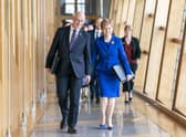 Outgoing First Minister Nicola Sturgeon and outgoing Deputy First Minister John Swinney (left) arrive for her last First Minster's Questions. Picture: Jane Barlow/PA Wire