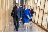 Outgoing First Minister Nicola Sturgeon and outgoing Deputy First Minister John Swinney (left) arrive for her last First Minster's Questions. Picture: Jane Barlow/PA Wire