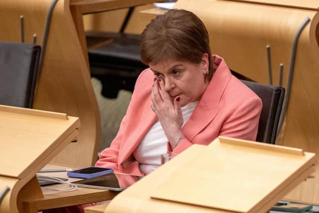 Former first minister Nicola Sturgeon wipes away a tear after delivering her final speech in the Scottish Parliament (Picture: Jane Barlow/PA Wire)