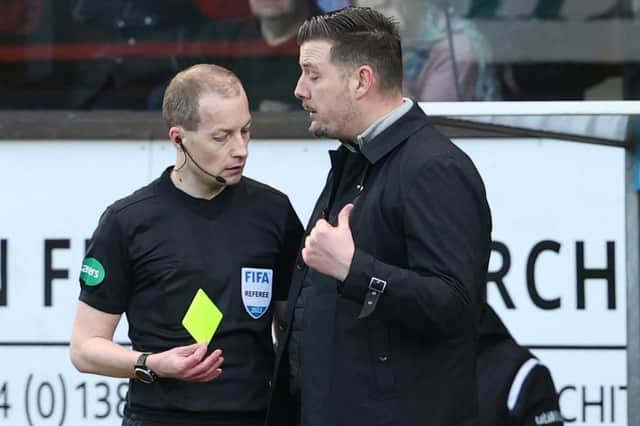 Dundee United manager Thomas Courts is booked by referee Willie Collum.  (Photo by Alan Harvey / SNS Group)