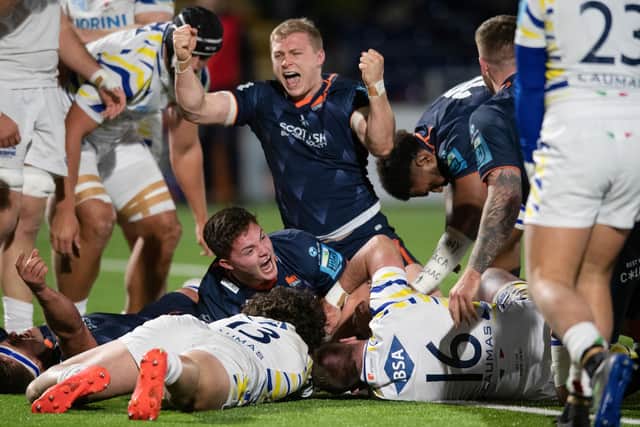 Joy for Edinburgh's Cammy Hutchison, top, and Paddy Harrison after the latter's late, late try secured the win over Zebre. (Photo by Mark Scates / SNS Group)