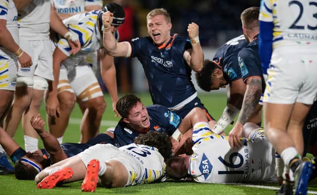 Joy for Edinburgh's Cammy Hutchison, top, and Paddy Harrison after the latter's late, late try secured the win over Zebre. (Photo by Mark Scates / SNS Group)