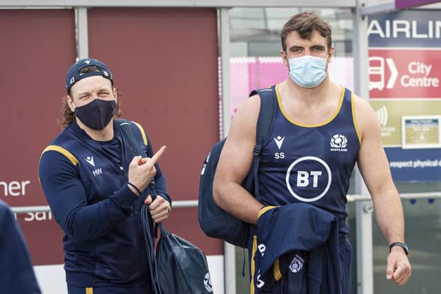 Simply the vest: Sam Skinner, pictured with the pointing Hamish Watson, dresses down for Scotland's flight to Paris. Picture: Ross MacDonald/SNS