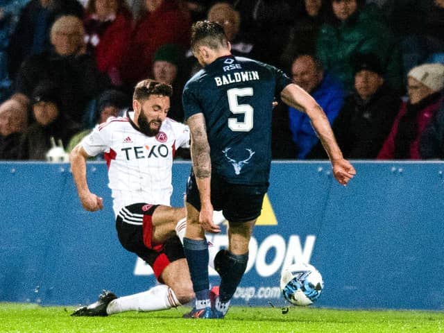 Aberdeen's Graeme Shinnie saw red for this late challenge on Jack Baldwin against Ross County.