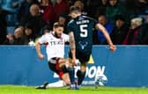Aberdeen's Graeme Shinnie saw red for this late challenge on Jack Baldwin against Ross County.