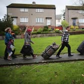 Syrian refugee families arriving at their new homes on the Isle of Bute  in 2015. The number of refugees granted asylum in Scotland has plummeted due to the pandemic.