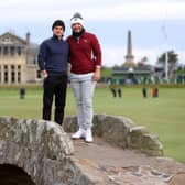 Ewen Ferguson, right, and playing partner Brad Simpson pose for a photograph on the Swilcan Bridge at St Andrews during the first day of the the Alfred Dunhill Links Championship. Picture: Richard Heathcote/Getty Images.