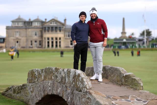 Ewen Ferguson, right, and playing partner Brad Simpson pose for a photograph on the Swilcan Bridge at St Andrews during the first day of the the Alfred Dunhill Links Championship. Picture: Richard Heathcote/Getty Images.