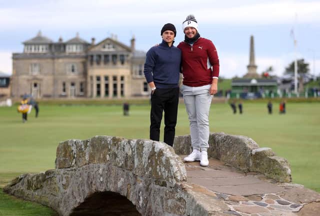 Ewen Ferguson, right, and playing partner Brad Simpson pose for a photograph on the Swilcan Bridge at St Andrews during the first day of the the Alfred Dunhill Links Championship. Picture: Richard Heathcote/Getty Images.