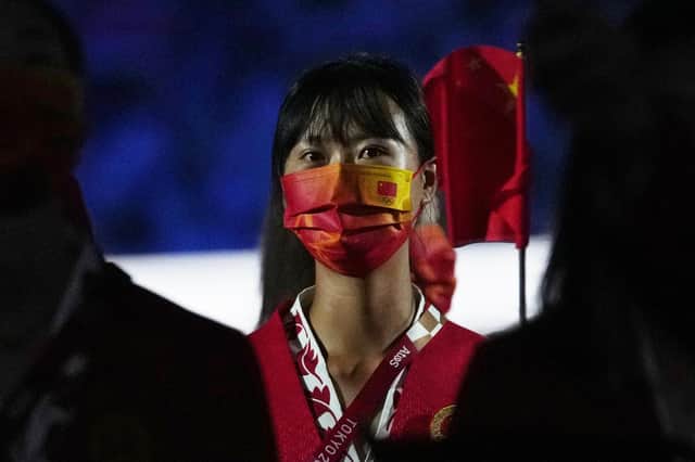 Athletes like this competitor from China were masked-up for the opening ceremony