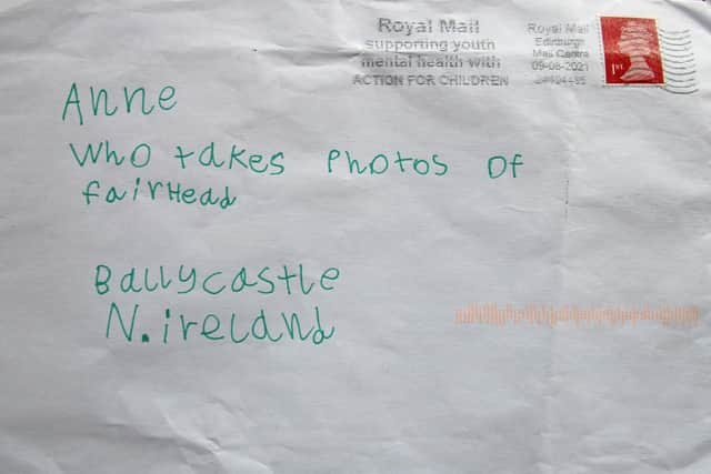 The letter from Cora Kelly Bell,  of Stirling, to her granny. It was addressed to only "Anne, who takes photographs of Fair Head, Ballycastle, N Ireland" and arrived less than 24 hours later.
Anne Kelly/PA Wire