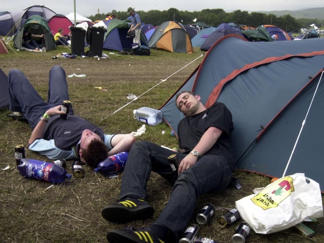 Campers relax after a hard day's partying at T in the Park in Balado.
