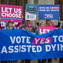 Supporters of a law change on assisted dying demonstrate outside the Scottish Parliament in May last year (Picture: Lisa Ferguson)