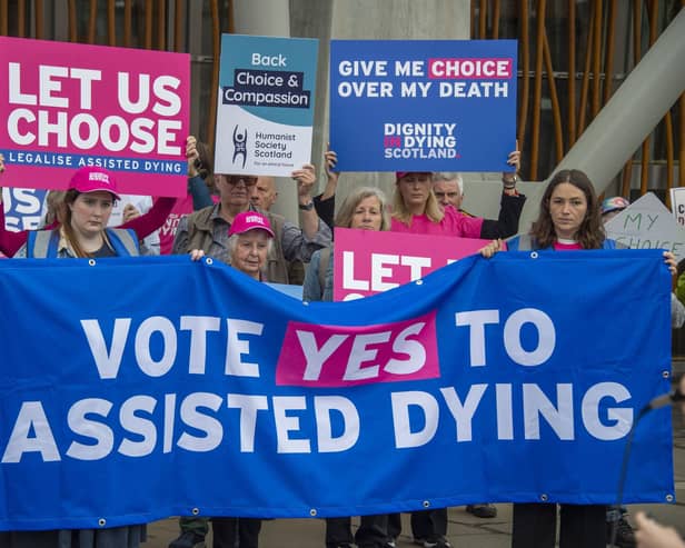Supporters of a law change on assisted dying demonstrate outside the Scottish Parliament in May last year (Picture: Lisa Ferguson)