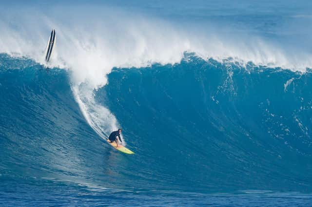 A surfer rides a wave at Waimea Bay on 15 January, 2021 in Haleiwa, Hawaii. PIC: Cliff Hawkins/Getty Images