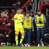 Luton and Bournemouth players applaud the fans after the match was abandoned.