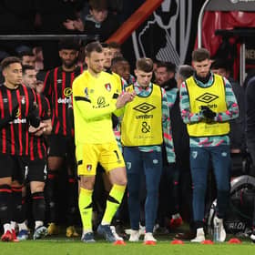 Luton and Bournemouth players applaud the fans after the match was abandoned.