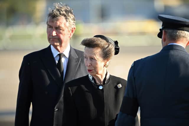 Princess Anne, Princess Royal (centre) and her husband Vice Admiral Timothy Laurence (left) watch as pallbearers from the Queen's Colour Squadron of the Royal Air Force (RAF) carry the coffin of Queen Elizabeth II. Picture: Paul Ellis - WPA Pool/Getty Images
