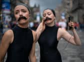 Lucille and Cecilia promote their Sea Lion Play on the Royal Mile during the 2018 Edinburgh Festival Fringe (Picture: Christopher Furlong/Getty Images)