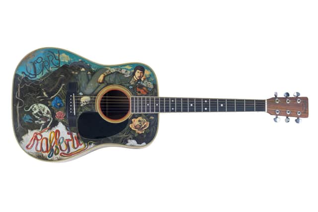 Painted guitar featuring Gerry Rafferty, by John Byrne, part of John Patrick Byrne: a Big Adventure at Kelvingrove Art Gallery and Museum