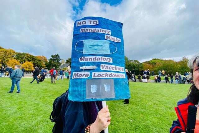 A sign showing the main messages from Saturday's anti-mask protest which include: 'no to mandatory masks, mandatory vaccines and more lockdowns.'