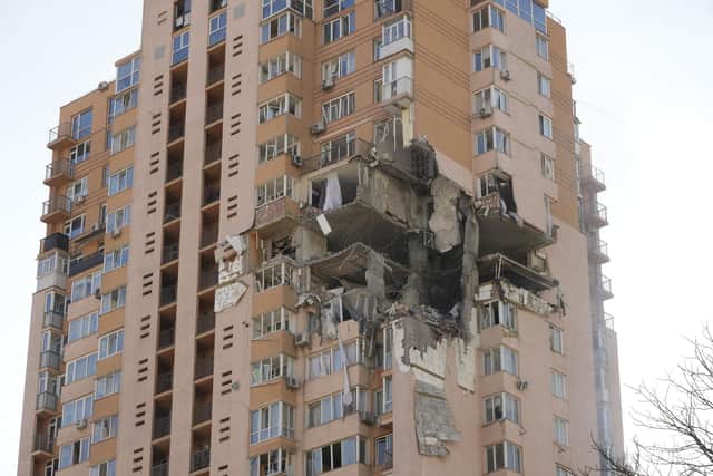 An apartment building damaged following a rocket attack on the city of Kyiv, Ukraine. Russian troops stormed toward Ukraine's capital on Saturday, and street fighting broke out as city officials urged residents to take shelter. (AP Photo/Efrem Lukatsky)