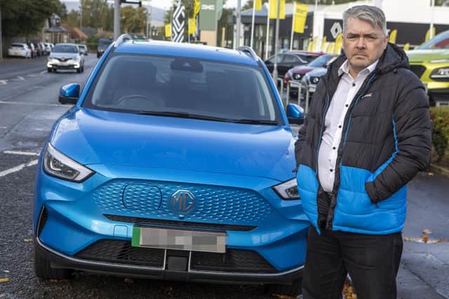 Brian Morrison and his MG ZS EV Photo: SWNS