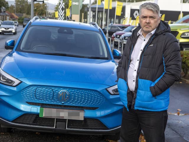 Brian Morrison and his MG ZS EV  Photo: SWNS