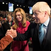 Boris Johnson is congratulated by his father Stanley Johnson after delivering a Conservative Party conference speech (Picture: Stefan Rousseau/PA)