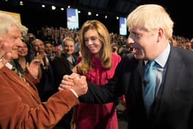 Boris Johnson is congratulated by his father Stanley Johnson after delivering a Conservative Party conference speech (Picture: Stefan Rousseau/PA)