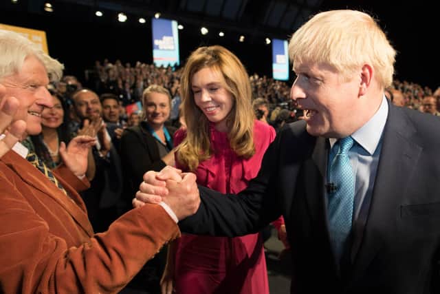 Boris Johnson is congratulated by his father Stanley Johnson after delivering a Conservative Party conference speech (Picture: Stefan Rousseau/PA)