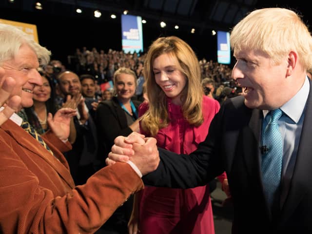 Boris Johnson is congratulated by his father Stanley Johnson after delivering a Conservative Party conference speech (Picture: Stefan Rousseau/PA)