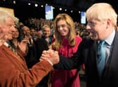 Boris Johnson is congratulated by his father Stanley Johnson after delivering a Conservative Party conference speech (Picture: Stefan Rousseau/PA)