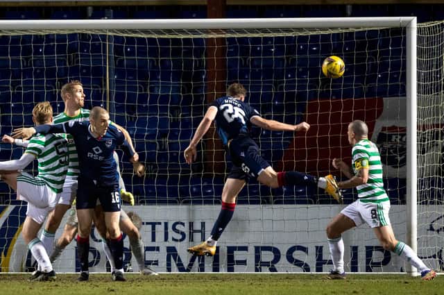 Jordan White heads Ross County into the lead in Dingwall. Picture: SNS