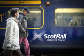 Commuters walking past a ScotRail train at Edinburgh's Waverley Station. Picture: Jane Barlow/PA Wire