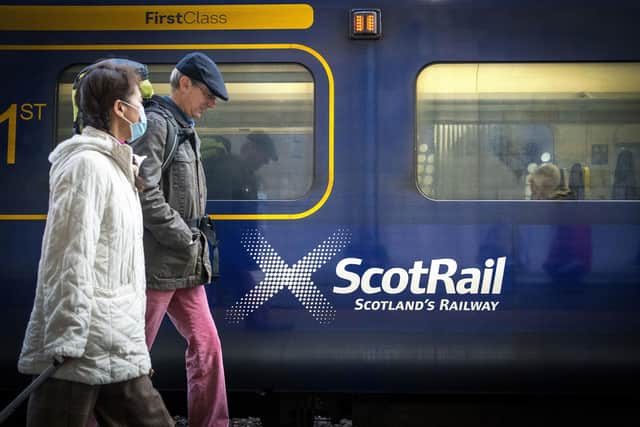 Commuters walking past a ScotRail train at Edinburgh's Waverley Station. Picture: Jane Barlow/PA Wire