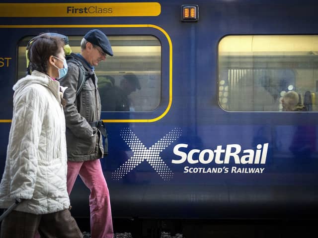 Commuters walking past a ScotRail train at Edinburgh's Waverley Station. Picture: Jane Barlow/PA Wire