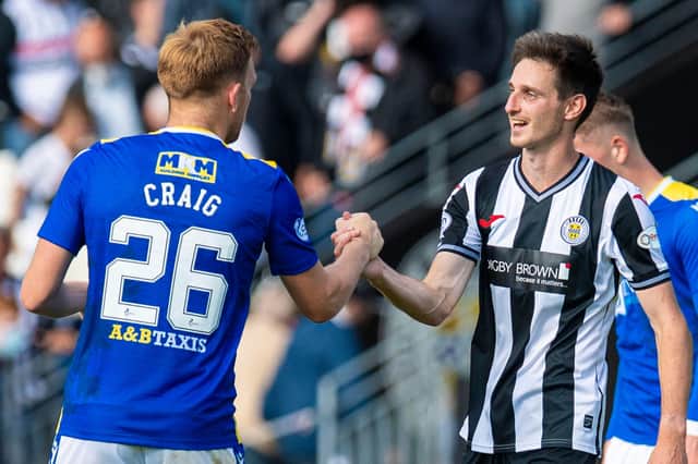 St Johnstone's Liam Craig greets his former team-mate and St Mirren left-back Scott Tanser.
