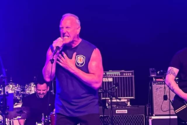 The Skids lead signer Richard Jobson on stage at a Scotland Euro 2024 fan event in Cologne on Monday.