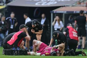 Jonny Gray is treated by the Exeter Chiefs medical staff after dislocating his left knee against La Rochelle.