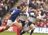 France's Olivier Brouzet can't quite catch Scotland's Glenn Metcalfe during a Six Nations encounter in 2003. Pic supplied by: Eric McCowat.