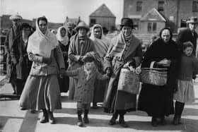 Islanders get ready to board SS Marloch 100 years ago to emigrate as part of a controversial scheme to create a new Catholic settlement in Alberta, Canada.  (Photo by Hulton Archive/Getty Images)