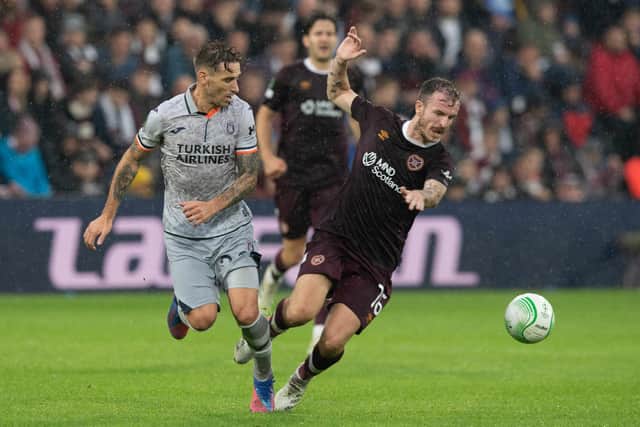 Istanbul Basaksehir's Lucas Biglia tackles Hearts Andy Halliday during their Europa Conference League match.  Photo by Paul Devlin / SNS Group