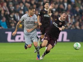 Istanbul Basaksehir's Lucas Biglia tackles Hearts Andy Halliday during their Europa Conference League match.  Photo by Paul Devlin / SNS Group