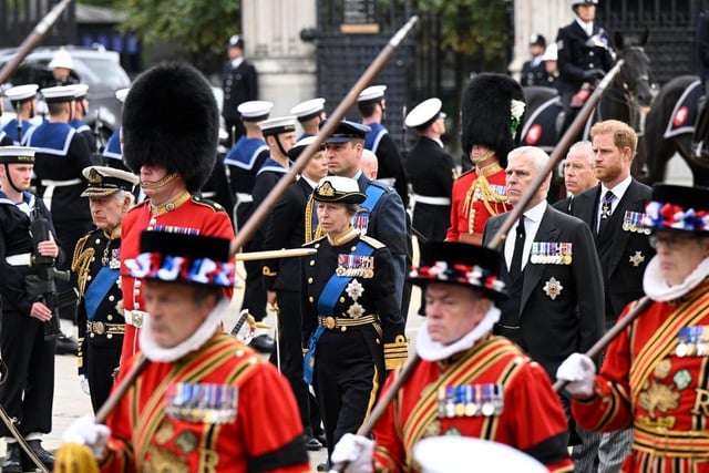 LONDON, ENGLAND - SEPTEMBER 19: King Charles III, Prince William, Prince of Wales, Anne, Princess Royal, Prince Andrew, Duke of York, and Prince Harry, Duke of Sussex, walk alongside Yeoman of the Guards at the State Funeral of Queen Elizabeth II on September 19, 2022 in London, England. Elizabeth Alexandra Mary Windsor was born in Bruton Street, Mayfair, London on 21 April 1926. She married Prince Philip in 1947 and ascended the throne of the United Kingdom and Commonwealth on 6 February 1952 after the death of her Father, King George VI. Queen Elizabeth II died at Balmoral Castle in Scotland on September 8, 2022, and is succeeded by her eldest son, King Charles III.  (Photo by Jeff Spicer/Getty Images)