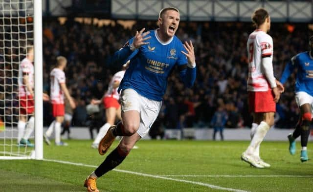 Midfielder John Lundstram, pictured celebrating after scoring Rangers' third goal against Leipzig, has flourished under Giovanni van Bronckhorst's management. (Photo by Alan Harvey / SNS Group)